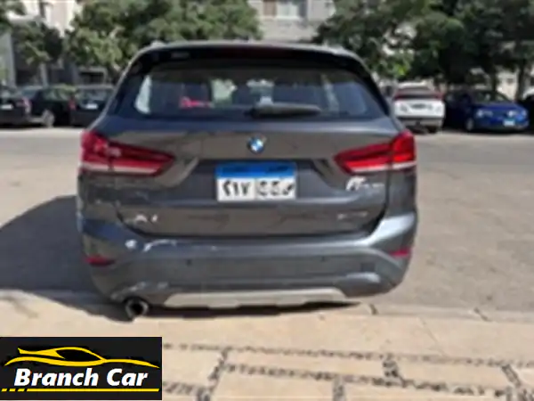 فرصة ذهبية: BMW X1 2021 فابريكة بالكامل | صيانات توكيل | كأنها جديدة للبيع!
