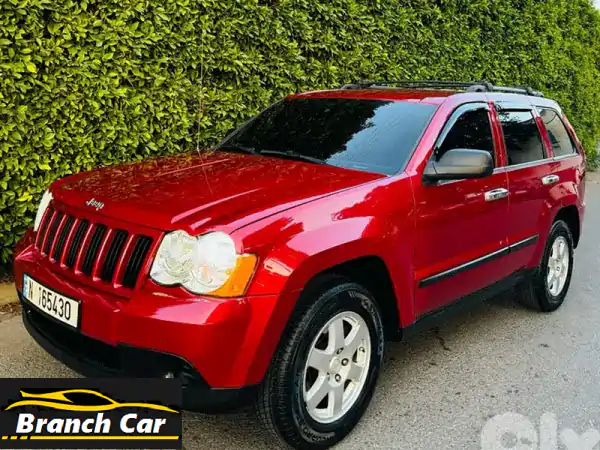 جيب جراند شيروكي 2009 حمراء، 4x4، بحالة ممتازة! فرصة...