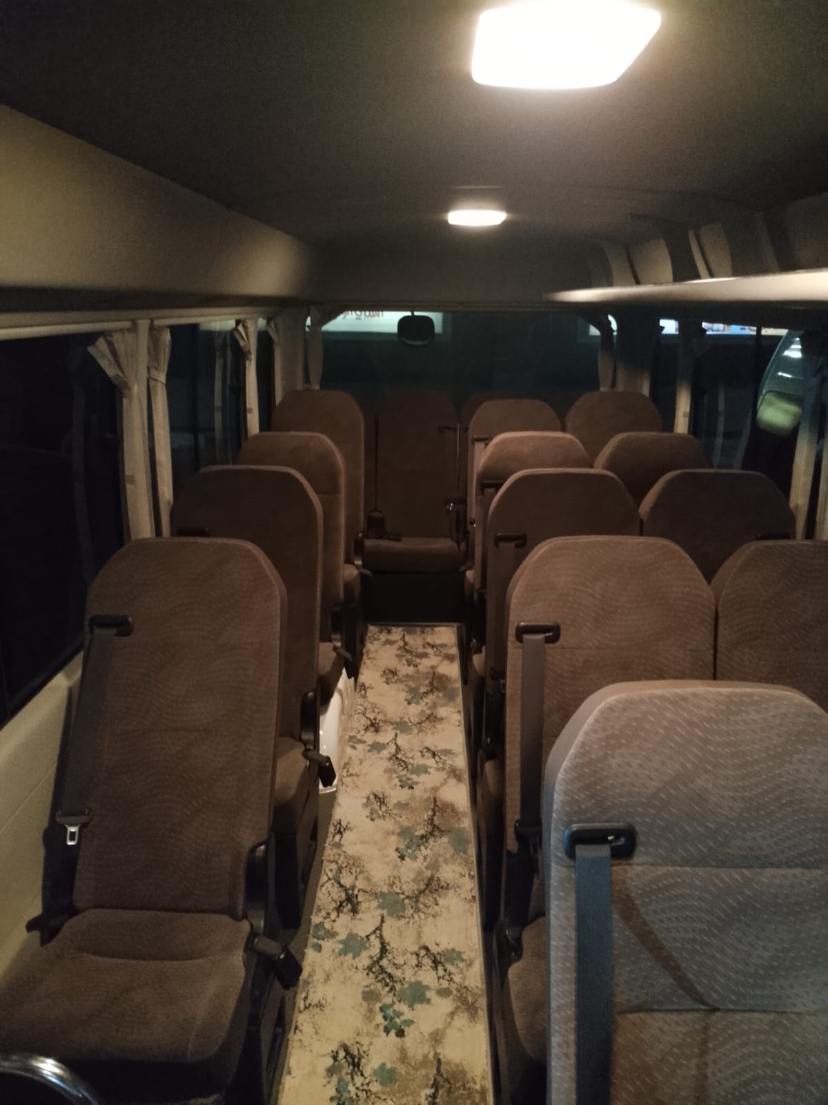 Rent a Toyota Coaster with a driver for premium large-group tours and events.