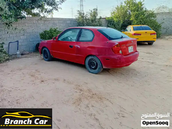 هيونداي فيرنا عدسة 2002 أوتوماتيك | حمراء جذابة...