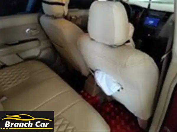 نيسان تيدا للبيع في عجمان | نظافة فائقة، كراسي جلد، شاشة وكاميرا، اطارات جديدة - فرصة لا تعوض!