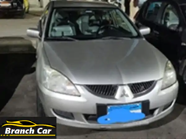 ميتسوبيشي لانسر بومة 2006 مانيوال: فبريكا دواخل...