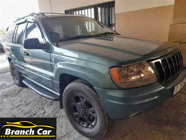 جيب جراند شيروكي 2005 لاريدو سوداء: قوة، راحة، ومواصفات استثنائية (فتحة سقف، مقاعد مدفأة، بطارية جديدة)