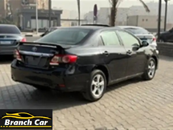 تويوتا كورولا 2011 | أعلى فئة بفتحة سقف وجنوط سبور | أسود فابريكة بحالة المصنع