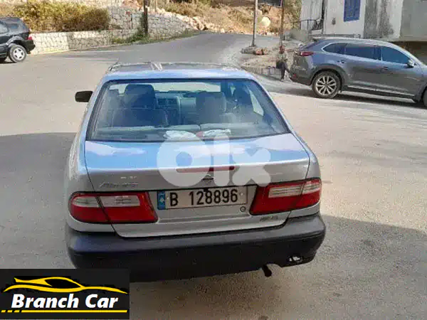 نيسان ألميرا 1999 فضي بحالة ممتازة - سيارة العمر...