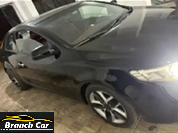 فرصة لا تعوض! كيا سيراتو كوبيه 2010 سوداء: أناقة رياضية وأداء موثوق بانتظارك!