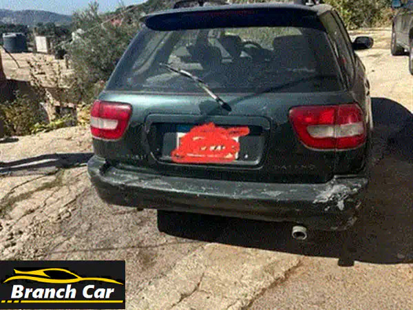 سوزوكي بالينو 1999 الخضراء: فرصتك الذهبية لسيارة عملية ومضمونة! (فحص كامل وميكانيك ممتاز)