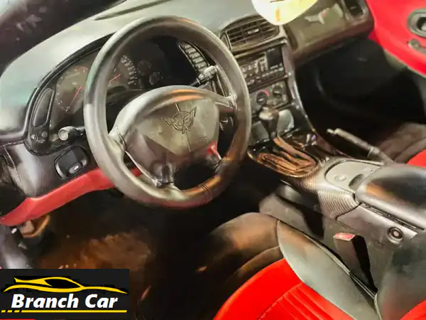 فرصة لا تفوّت: شيفروليه كورفيت 2001 حمراء – حالة استثنائية | للبيع أو البدل بسيدان 4 أبواب