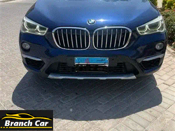 BMW X1 2017 ذهبي | حالة ممتازة أول مالك | دهان المصنع 100% | ضمان الفحص