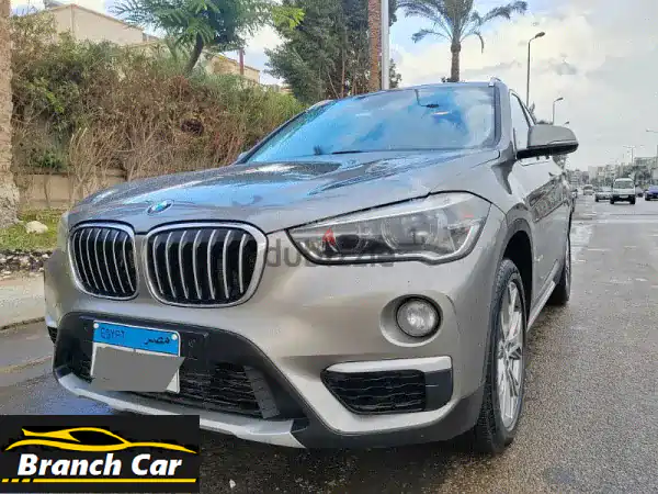 BMW X1 2017 ذهبي | حالة ممتازة أول مالك | دهان المصنع 100%...