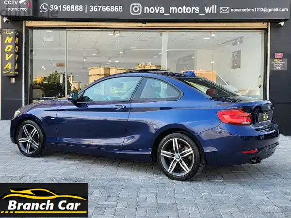 حصريًا: BMW 220i Sport 2018 أزرق - وكالة البحرين، فل أوبشن، جلد أحمر فخم!