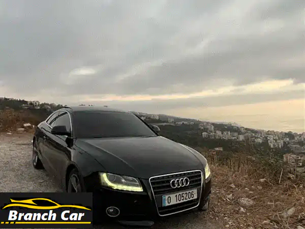 أودي A5 2009 للبيع: أناقة الأداء الأسود بقلب أحمر...