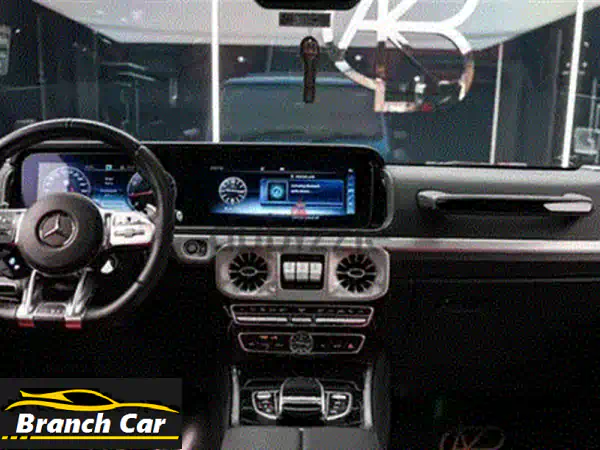 امتلك أسطورة الطرقات: مرسيدس G63 AMG 2023 | لون أزرق/أحمر حصري | 9,000 كم فقط | جاهزة للتسليم الفوري